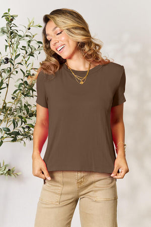 Round neck short sleeve brown t-shirt, slightly stretchy, worn by a smiling woman.