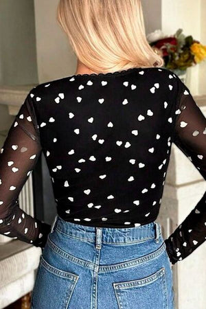 Heart square neck long sleeve bodysuit with lace detail and heart pattern.