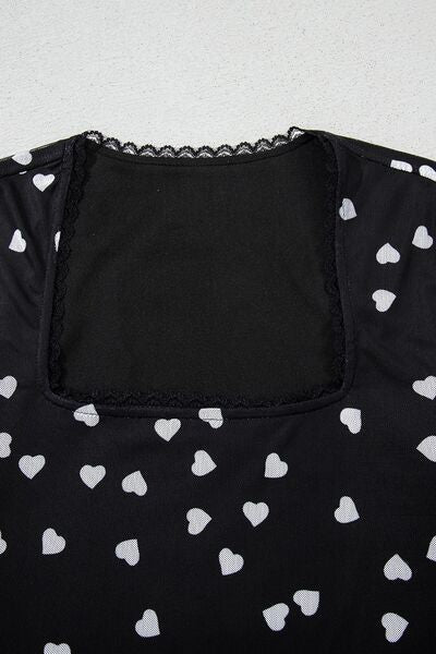 Heart square neck long sleeve bodysuit with lace detail and heart pattern.