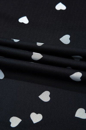 Heart print detail on black semi-sheer fabric bodysuit.