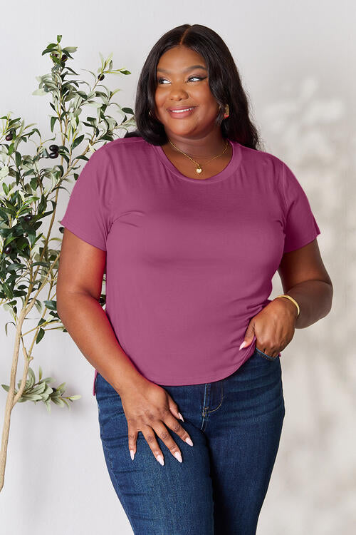 Basic Bae Full Size Round Neck Short Sleeve T-Shirt in plum, slightly stretchy, made of 95% rayon and 5% spandex, worn by a model.