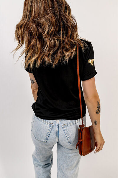Bow Print Sequin Round Neck Short Sleeve T-Shirt with Multicolored Bow Patterns.