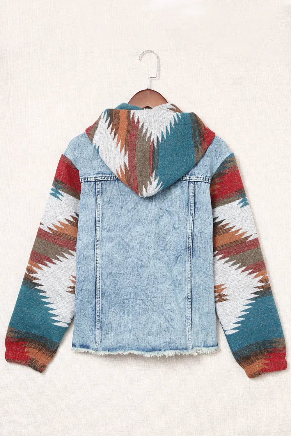 Drawstring hooded denim jacket with patterned sleeves and no stretch.