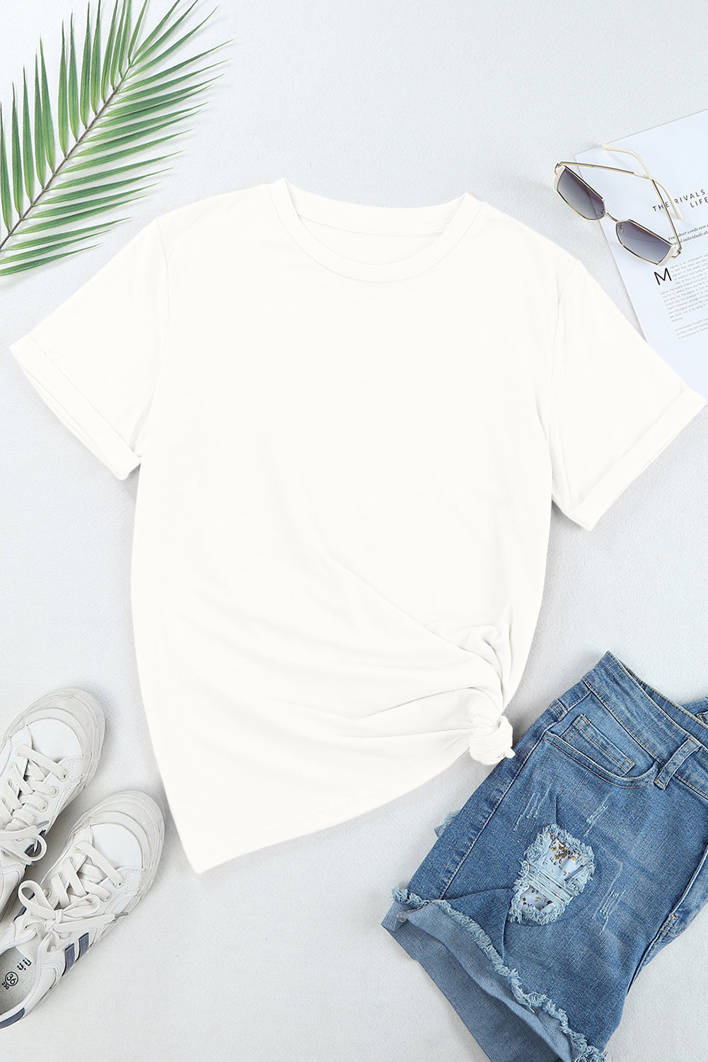 Pumpkin round neck short sleeve t-shirt on display with casual accessories.