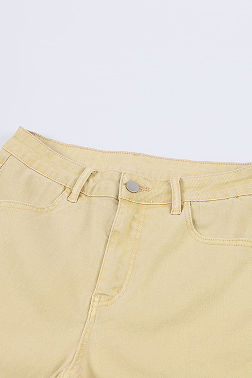 Raw Edge Mid Waist Flared Jeans with pockets and raw hem.