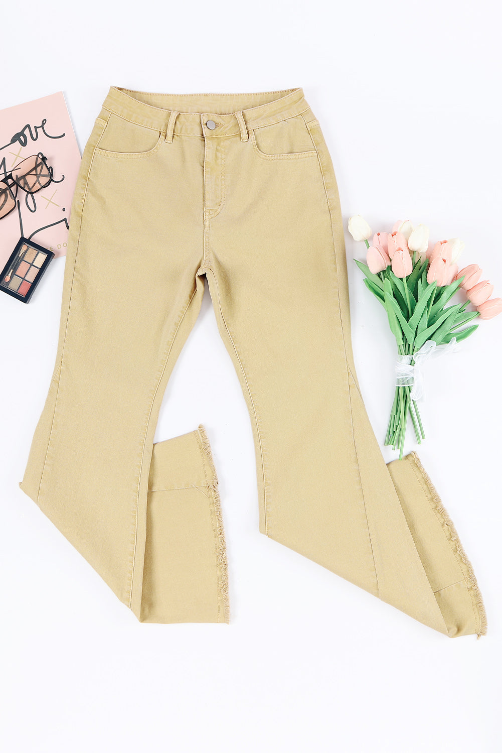 Raw edge mid waist flared jeans with pockets and slightly stretchy fabric.