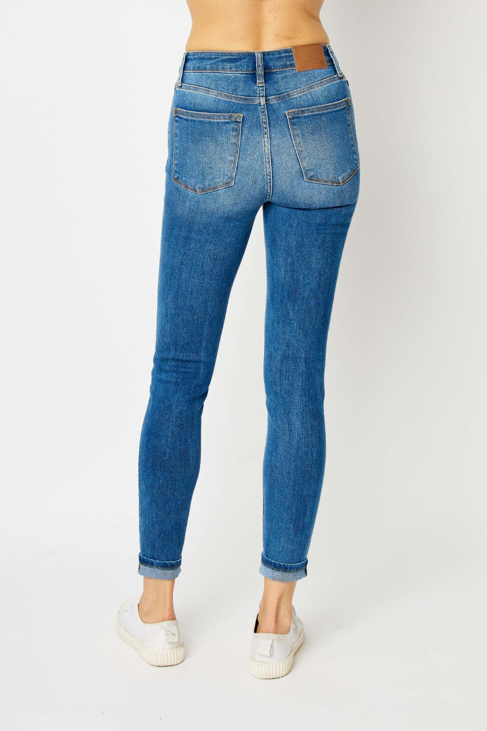 Judy Blue Full Size Cuffed Hem Skinny Jeans in blue denim with trendy cuffed hems and slim fit.