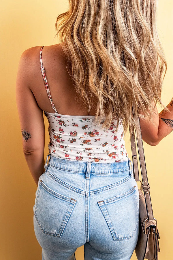 Floral frilled trim spaghetti strap bodysuit with jeans.