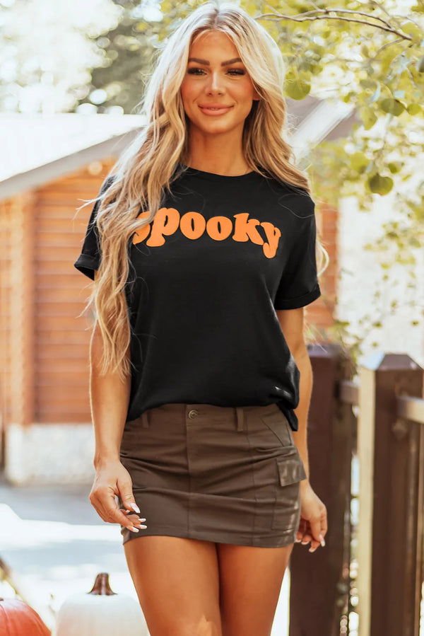 Spooky round neck short sleeve t-shirt, basic style, black color with orange lettering.