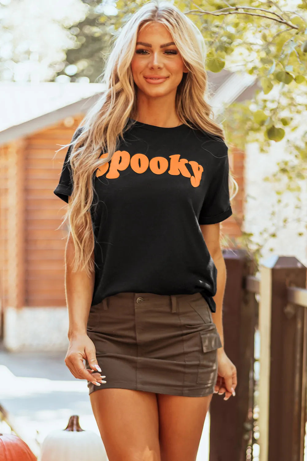 Spooky round neck short sleeve t-shirt, basic style, black color with orange lettering.