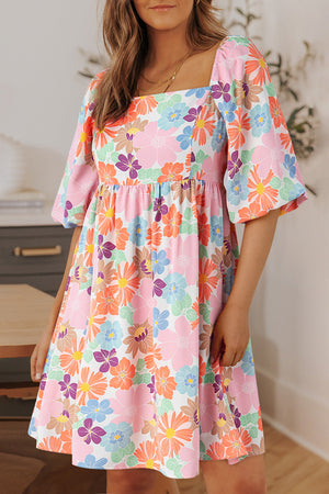 Printed half sleeve mini dress with colorful floral pattern, short sleeves, and a square neckline.