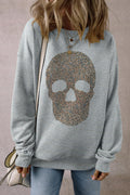 Skull round neck long sleeve sweatshirt with rhinestone embellishment, made of polyester and cotton blend.