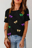 Bow Print Sequin Round Neck Short Sleeve T-Shirt with Multicolored Bow Patterns.
