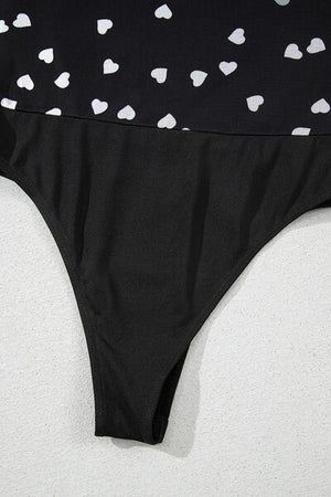 Heart square neck long sleeve bodysuit with lace detail and semi-sheer fabric.