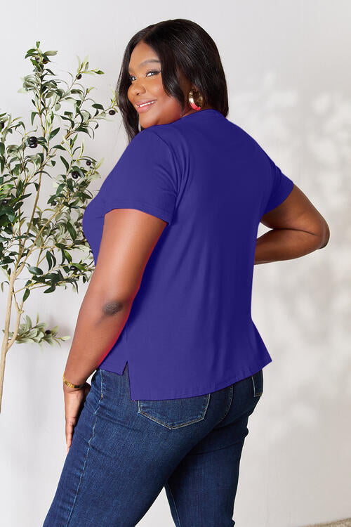 Basic Bae Full Size Round Neck Short Sleeve T-Shirt in blue, plus-size model, stretchy comfortable fit.