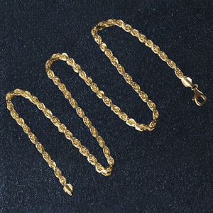 14k yellow gold solid diamond cut rope chain with lobster clasp and 5mm width on black background