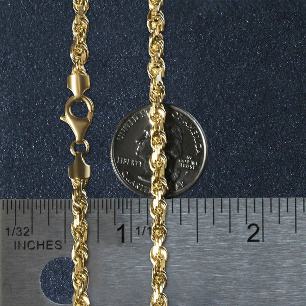 14k yellow gold solid diamond cut rope chain 5mm width with lobster clasp next to ruler and coin for scale