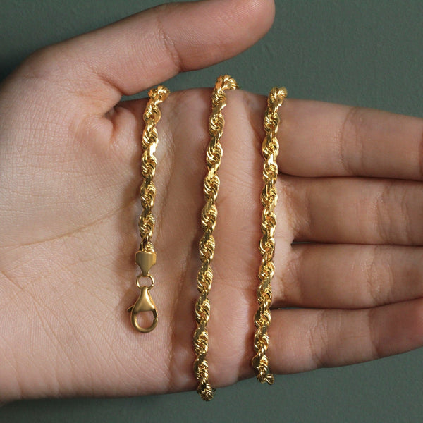 14k yellow gold solid diamond cut rope chain with lobster clasp, 5mm width shown on hand