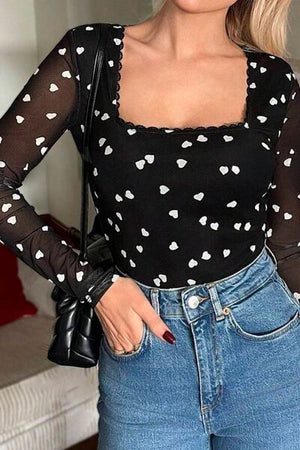 Heart square neck long sleeve bodysuit with lace detail and semi-sheer sleeves.