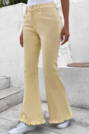 Raw edge mid waist flared jeans with pockets and raw hem.