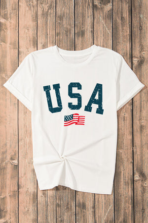 USA round neck short sleeve t-shirt with graphic print on wooden background.