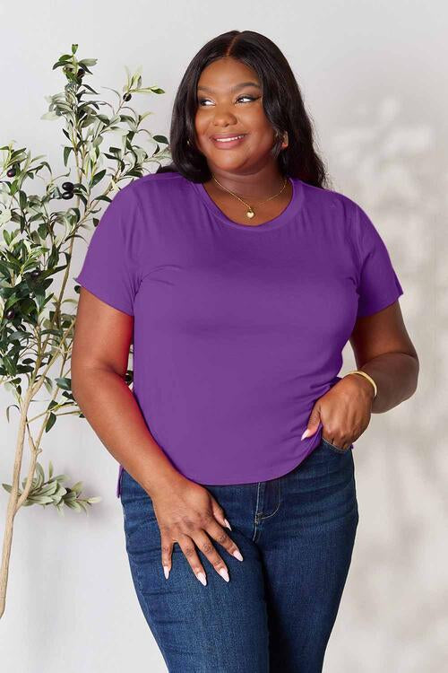 Basic Bae Full Size Round Neck Short Sleeve T-Shirt in purple on model, slightly stretchy fabric with slit detail.