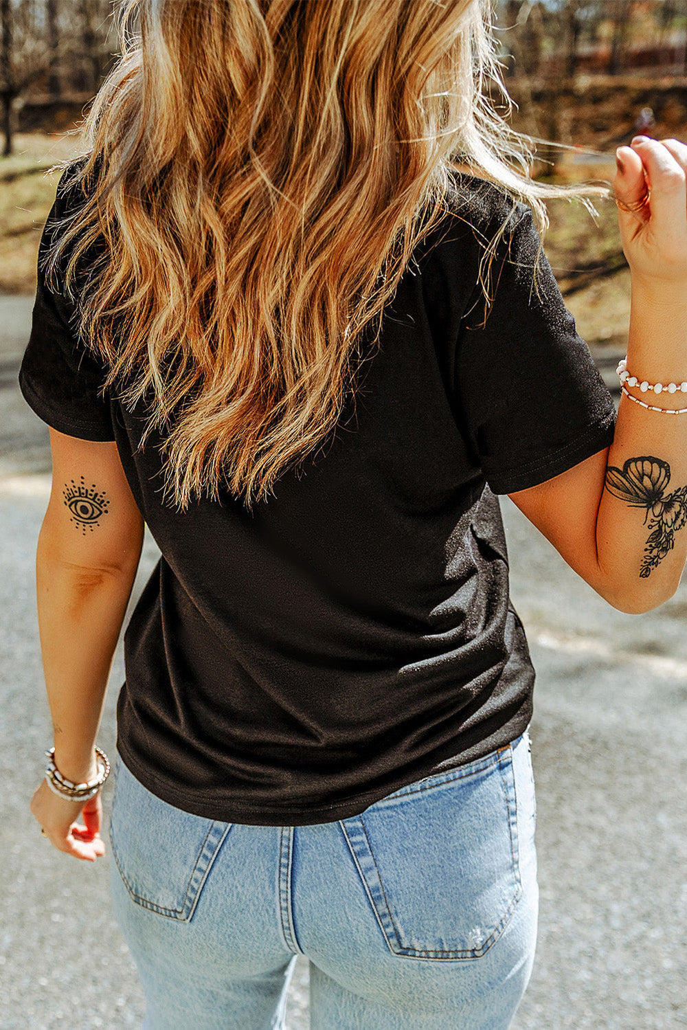 Skull round neck short sleeve t-shirt with rhinestone design.