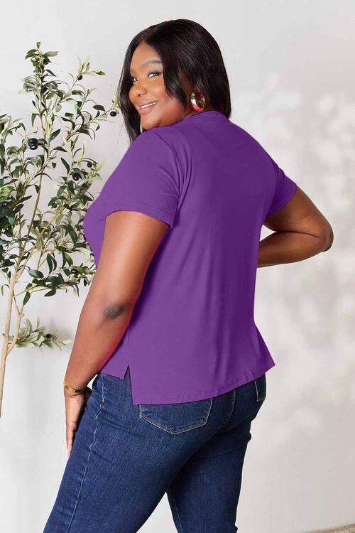 Basic Bae Full Size Round Neck Short Sleeve T-Shirt in purple with slit detail, slightly stretchy fabric, worn by a model.