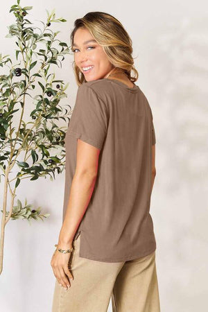 Round neck short sleeve t-shirt in taupe, made from rayon and spandex, featuring a relaxed fit and side slits.
