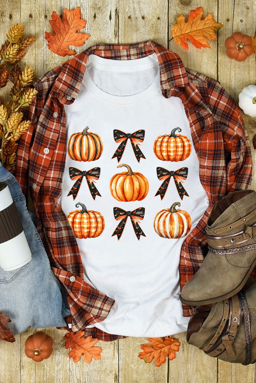 Pumpkin round neck short sleeve t-shirt with pumpkin and bow design on wooden background.