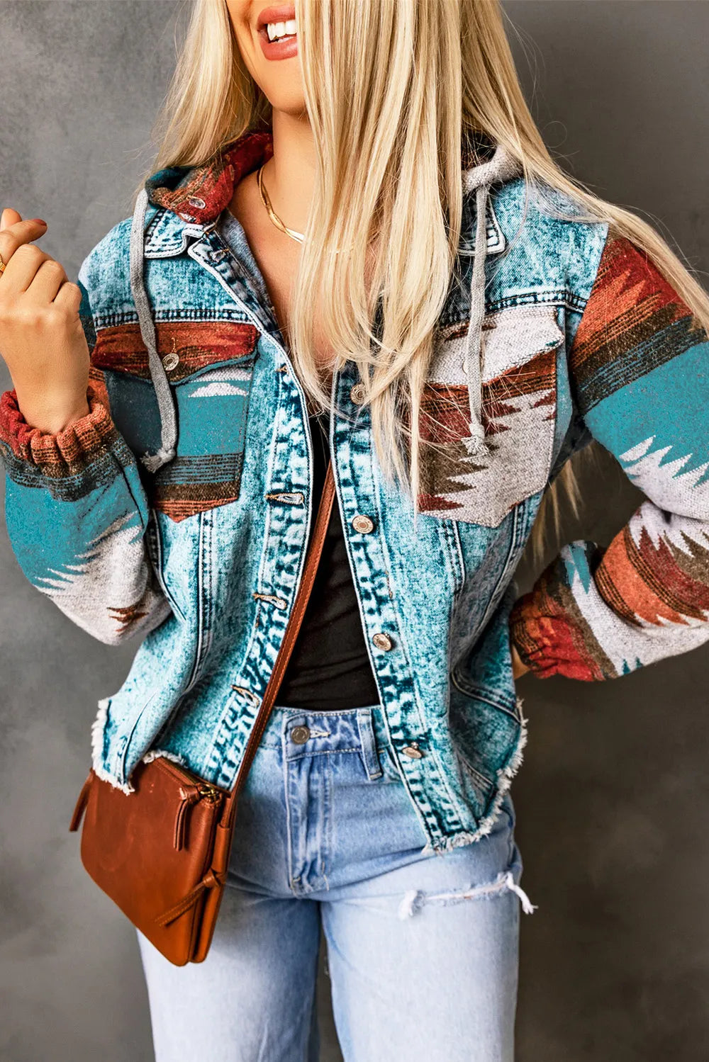 Drawstring hooded pocketed denim jacket with colorful pattern and no stretch.