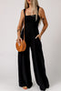 Smocked square neck wide leg jumpsuit with pockets, solid pattern, sleeveless style.