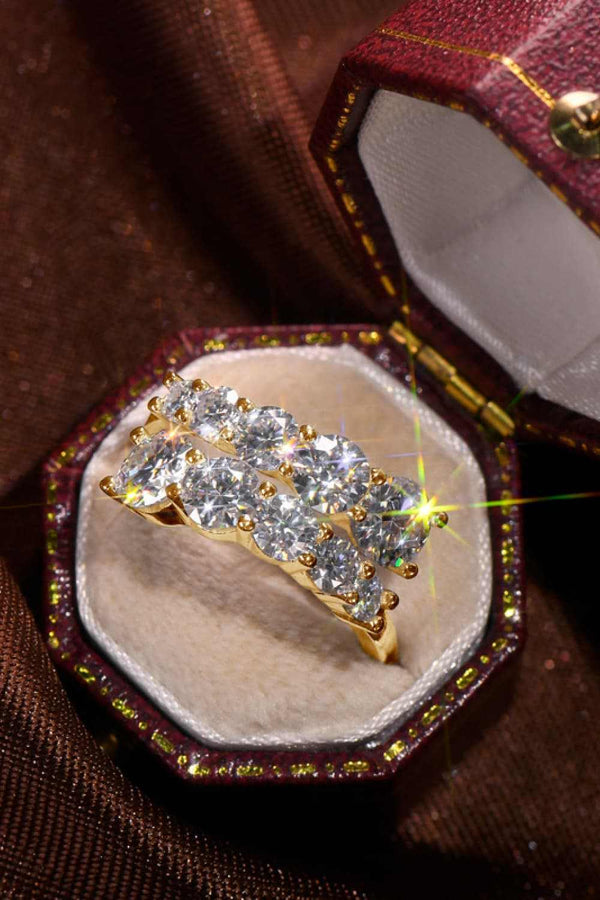 Moissanite jewelry in gold-plated 925 sterling silver ring in decorative box.