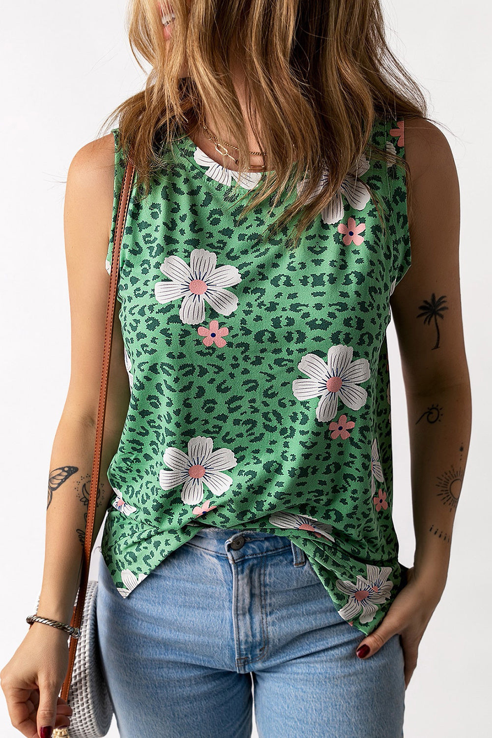 Printed side slit round neck tank with floral and leopard pattern, casual chic style.