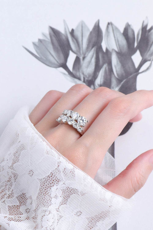 Moissanite 925 sterling silver ring with platinum and 18K gold plating, minimalist style.