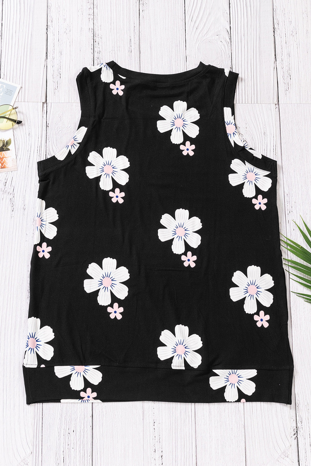 Printed side slit round neck tank with floral pattern, sleeveless design, and chic casual style.