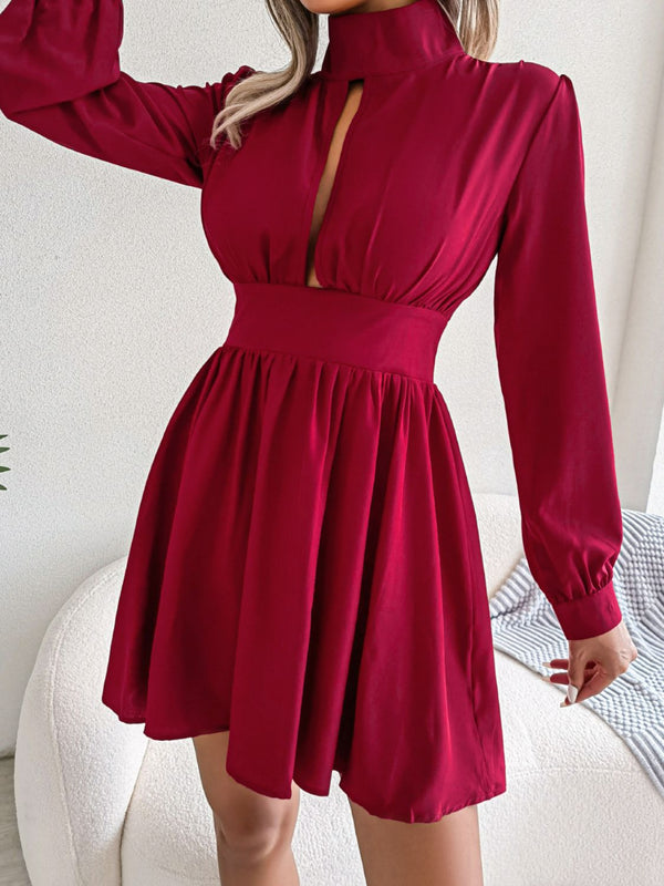 Cutout turtleneck A-line mini dress with keyhole neckline and long sleeves.