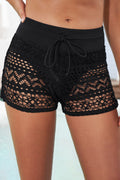 Full-size drawstring waist swim shorts with openwork lace, solid pattern, and moderate stretch.