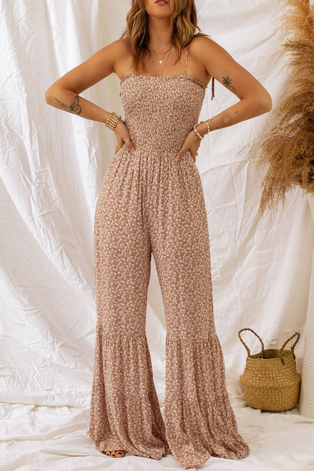 Floral spaghetti strap smocked wide leg jumpsuit, classy style.