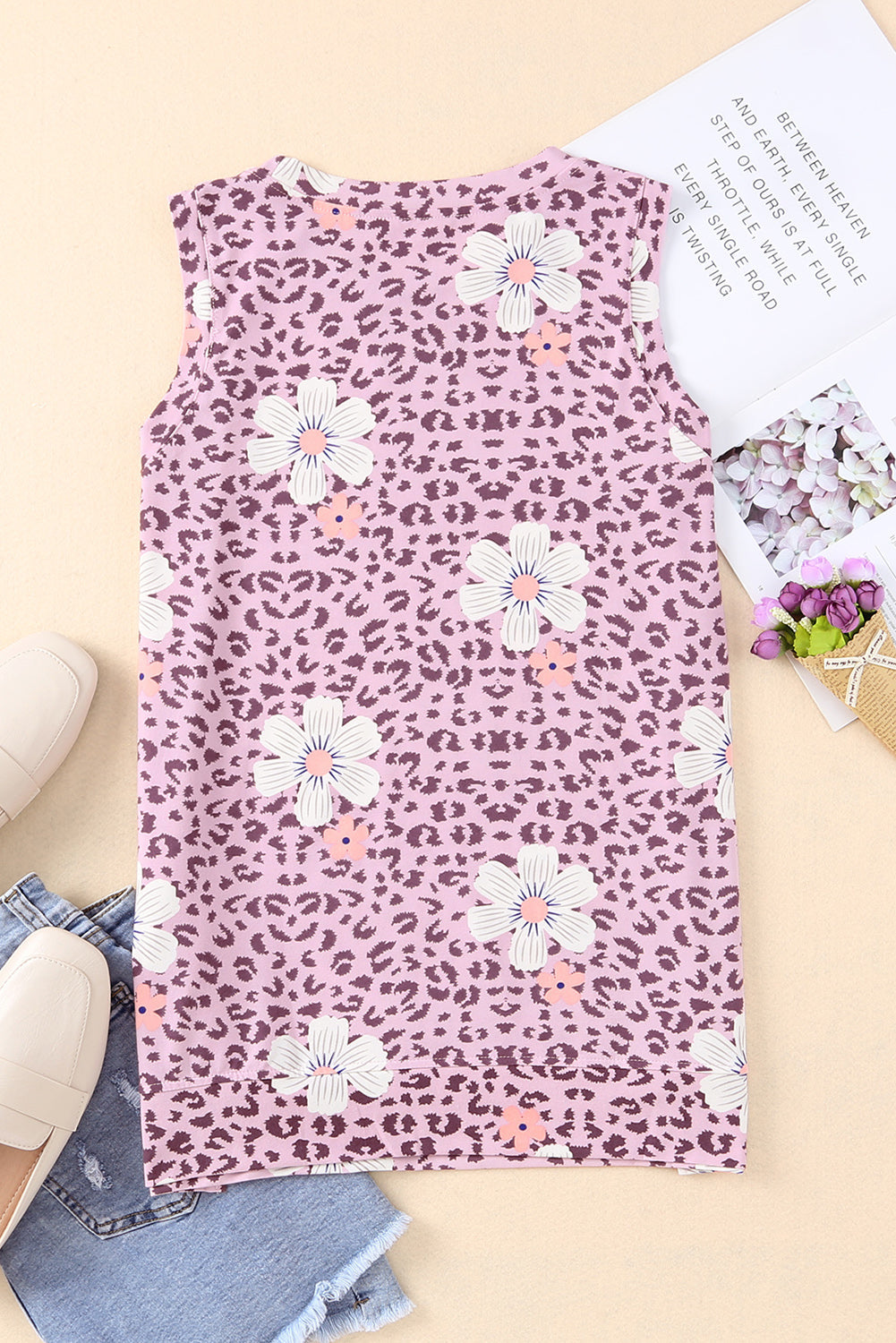 Printed side slit round neck tank with floral and leopard pattern.