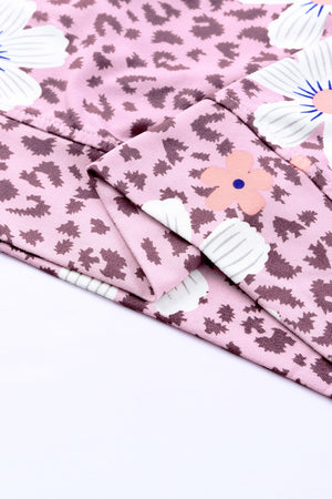 Printed side slit round neck tank with floral pattern, sleeveless casual style.