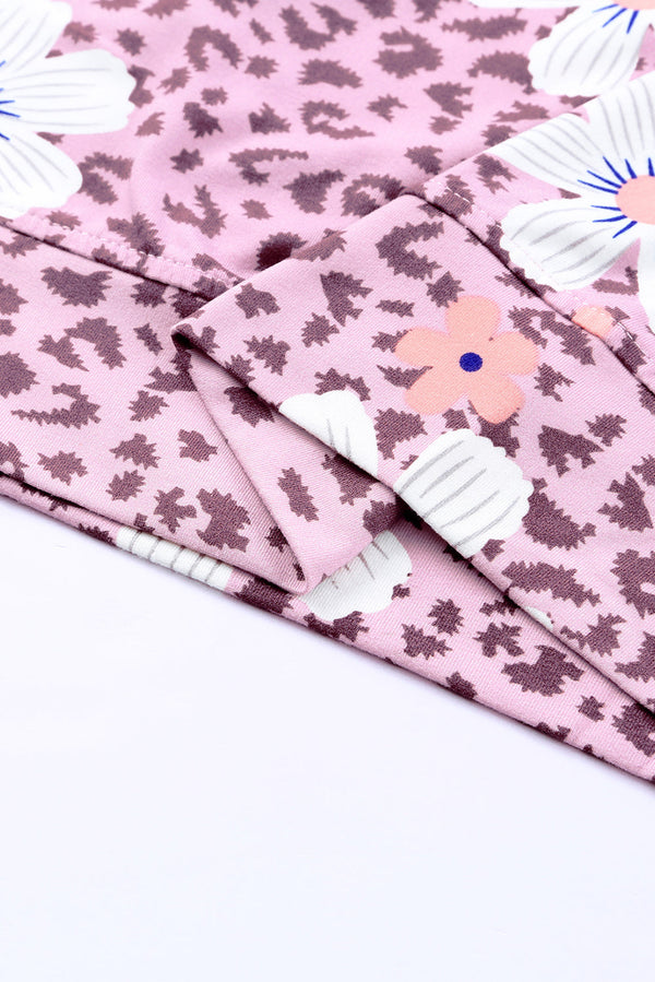Printed side slit round neck tank with floral pattern, sleeveless casual style.
