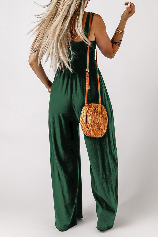 Smocked square neck wide leg jumpsuit with pockets, sleeveless, solid pattern.