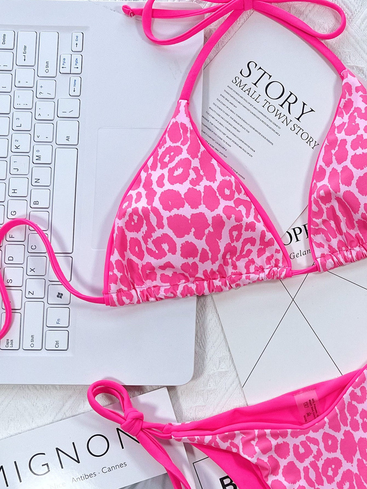 Leopard print halter neck tie side bikini set with pink accents.