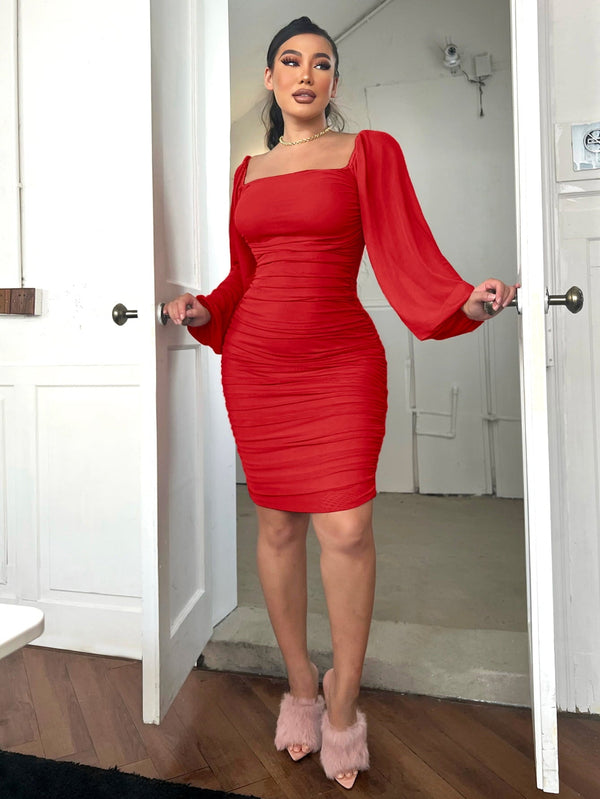 Chic red zip-back ruched bodycon dress with square neck and long sleeves.