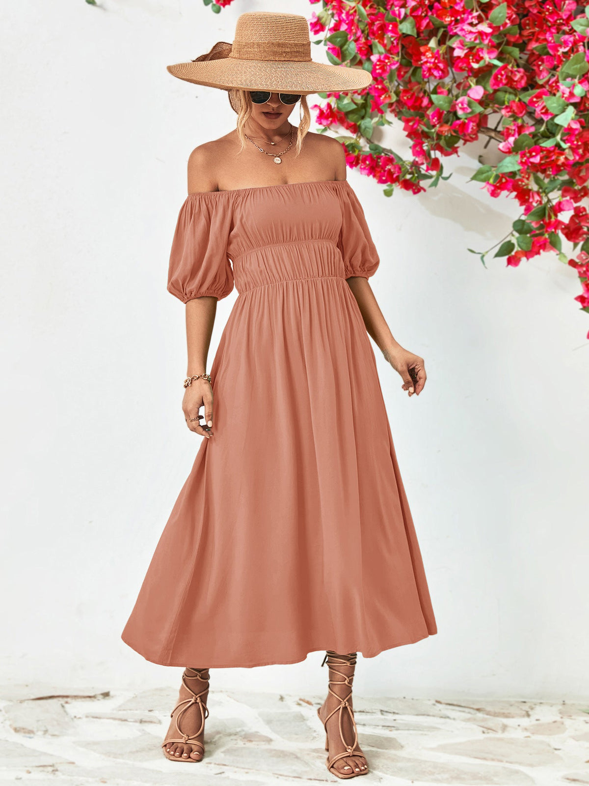 Off-shoulder balloon sleeve midi dress with puff sleeves and A-line hem.