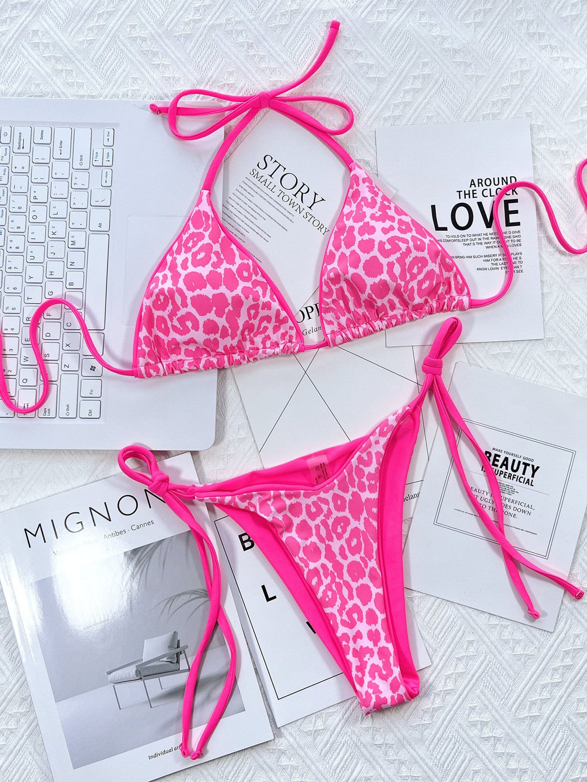 Leopard print halter neck tie side bikini set in pink with removable padding.