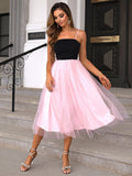 Two-tone spaghetti strap mesh dress in black and pink, sleeveless with a midi length and chic style.