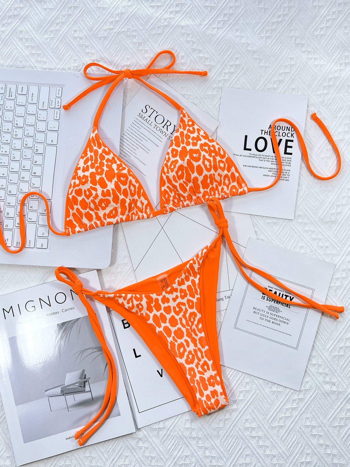 Leopard print halter neck tie side bikini set with removable padding.