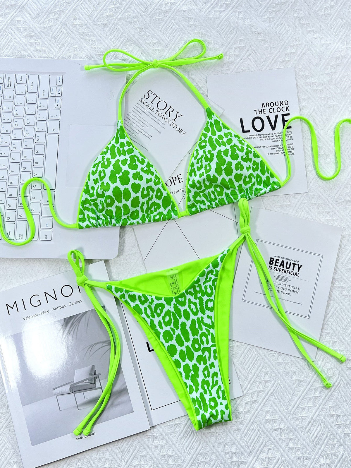 Leopard print halter neck tie-side bikini set with removable padding.